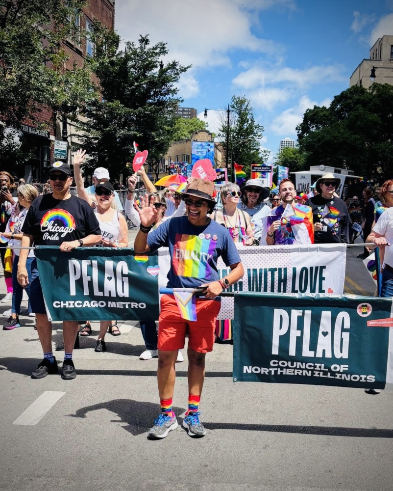Chicago Metro PFLAG members and PFLAG Council of Illinois members with banners participating in Chicago Pride Parade.